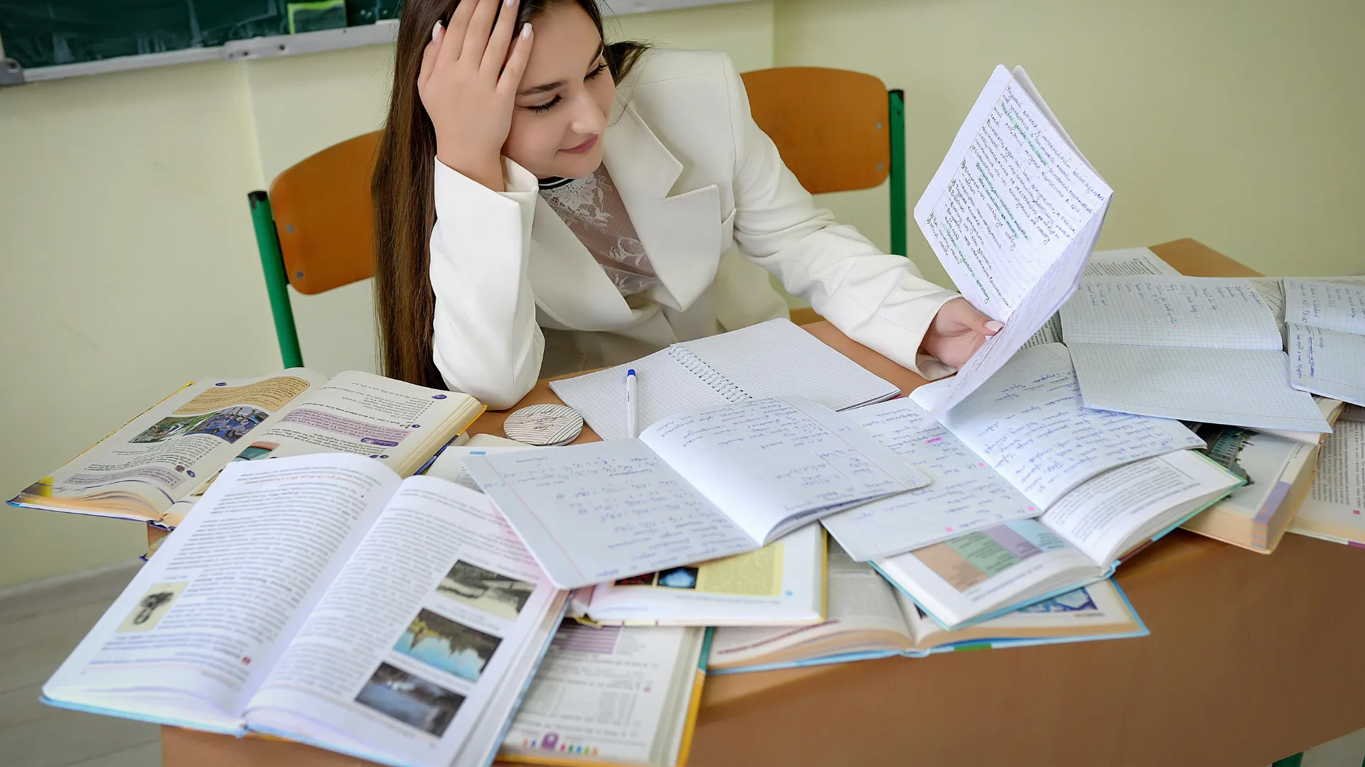 Female Student Reading Assignment Paper